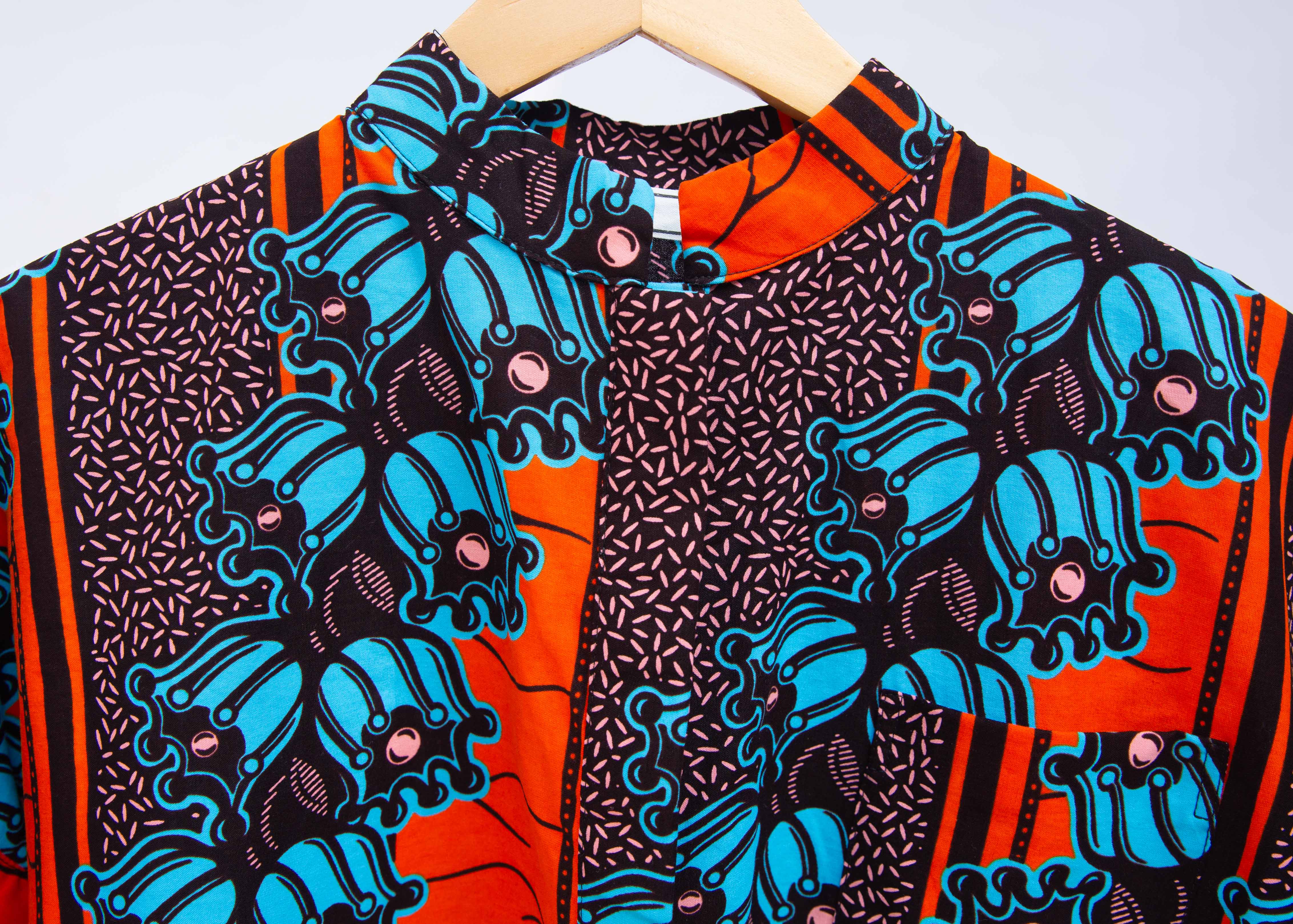 Display of orange and blue floral shirt.
