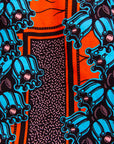 Close up display of orange and blue floral shirt, fabric.
