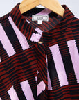 Display of pink and brown striped dress.