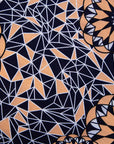 Close up Display of navy, beige and white geometric print dress, fabric.