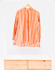 display of a peach and pink striped shirt