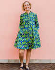 model wearing a blue and green cactus design dress