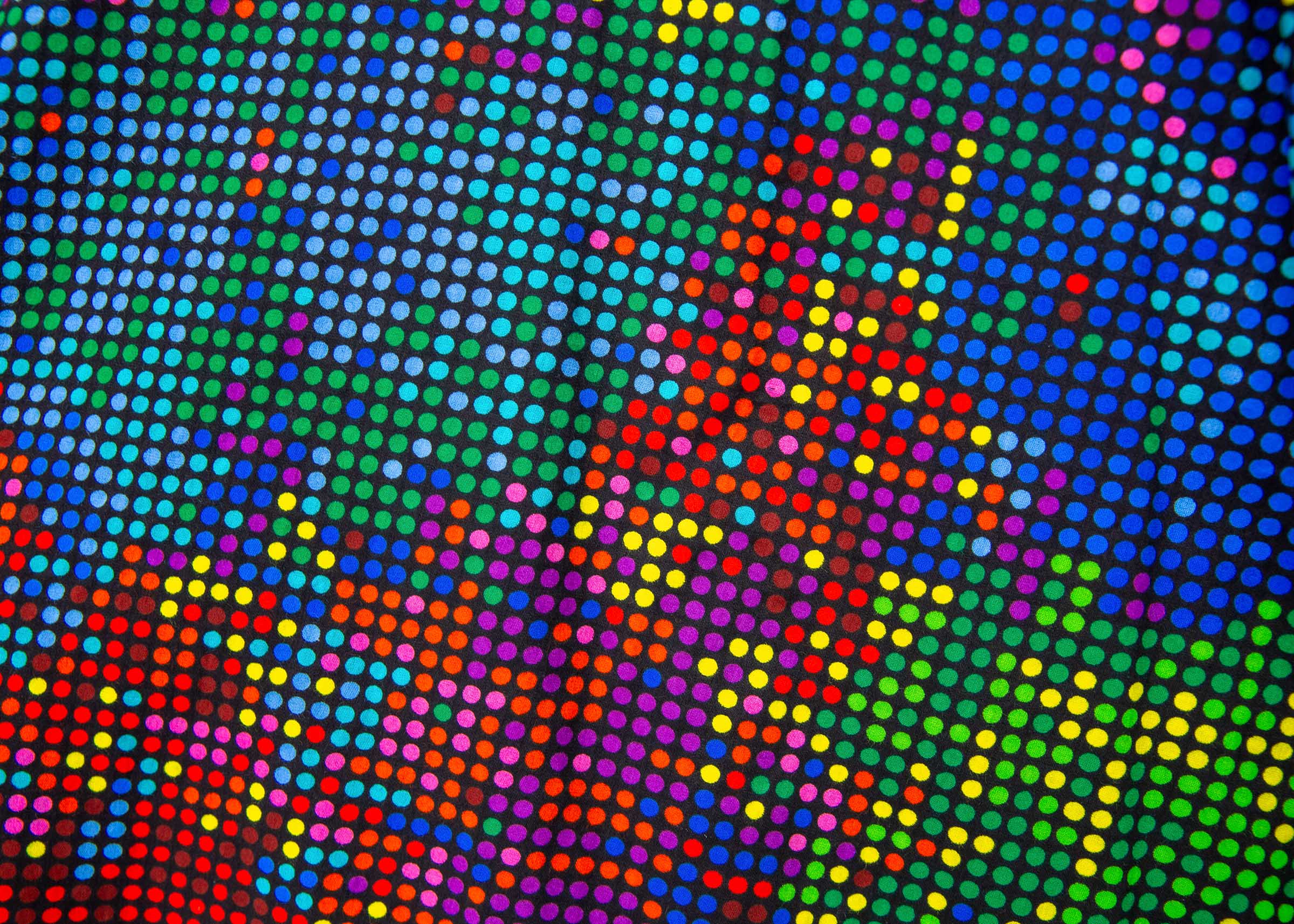 Close up display of rainbow pixelated print dress. 