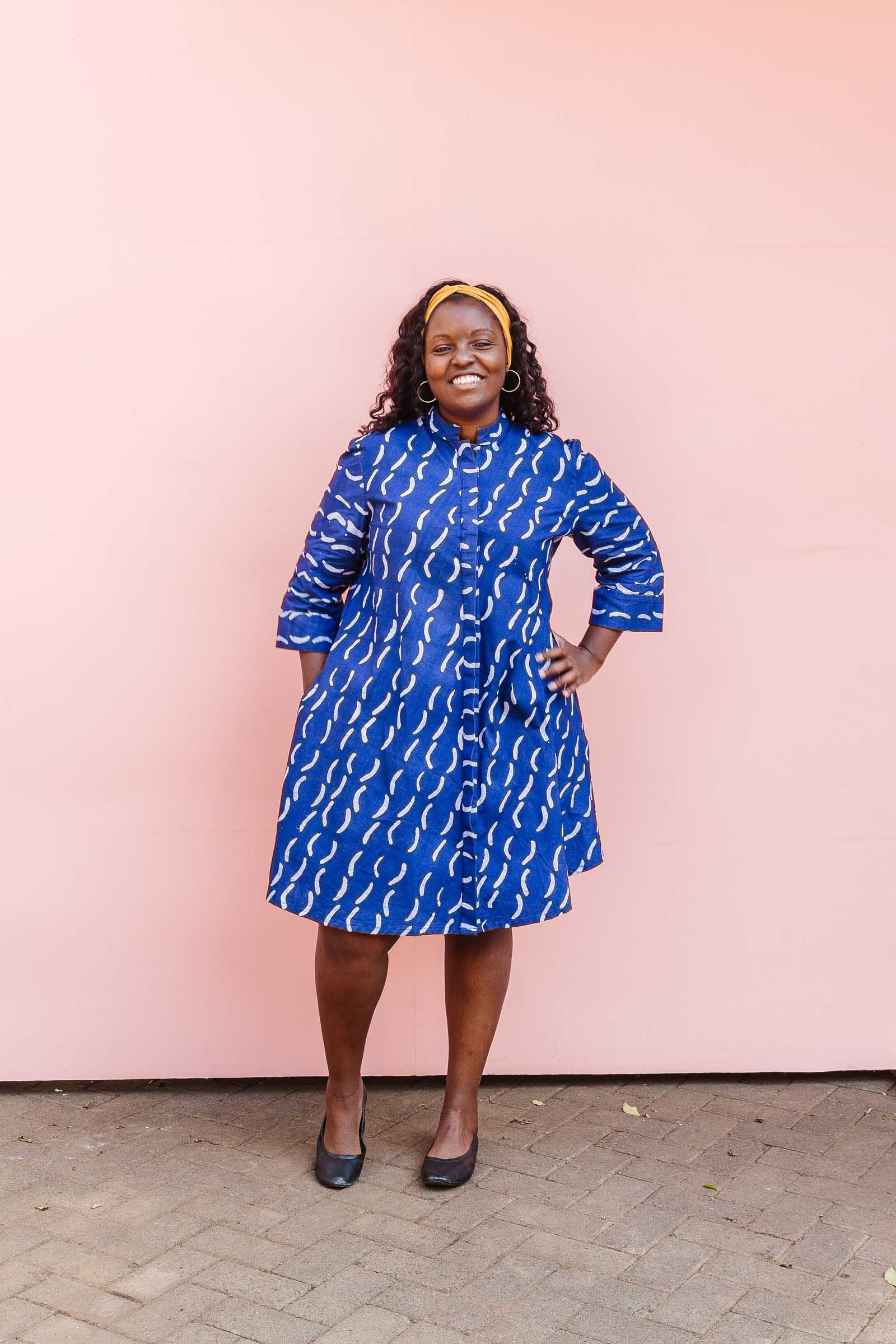 The model is wearing blue and white batik dress.